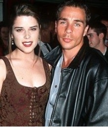 A picture of Neve Campbell with Jeff Colt.
